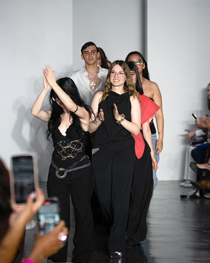 Ferrari Fashion School students walk the runway at the end of the Living Matters fashion show.